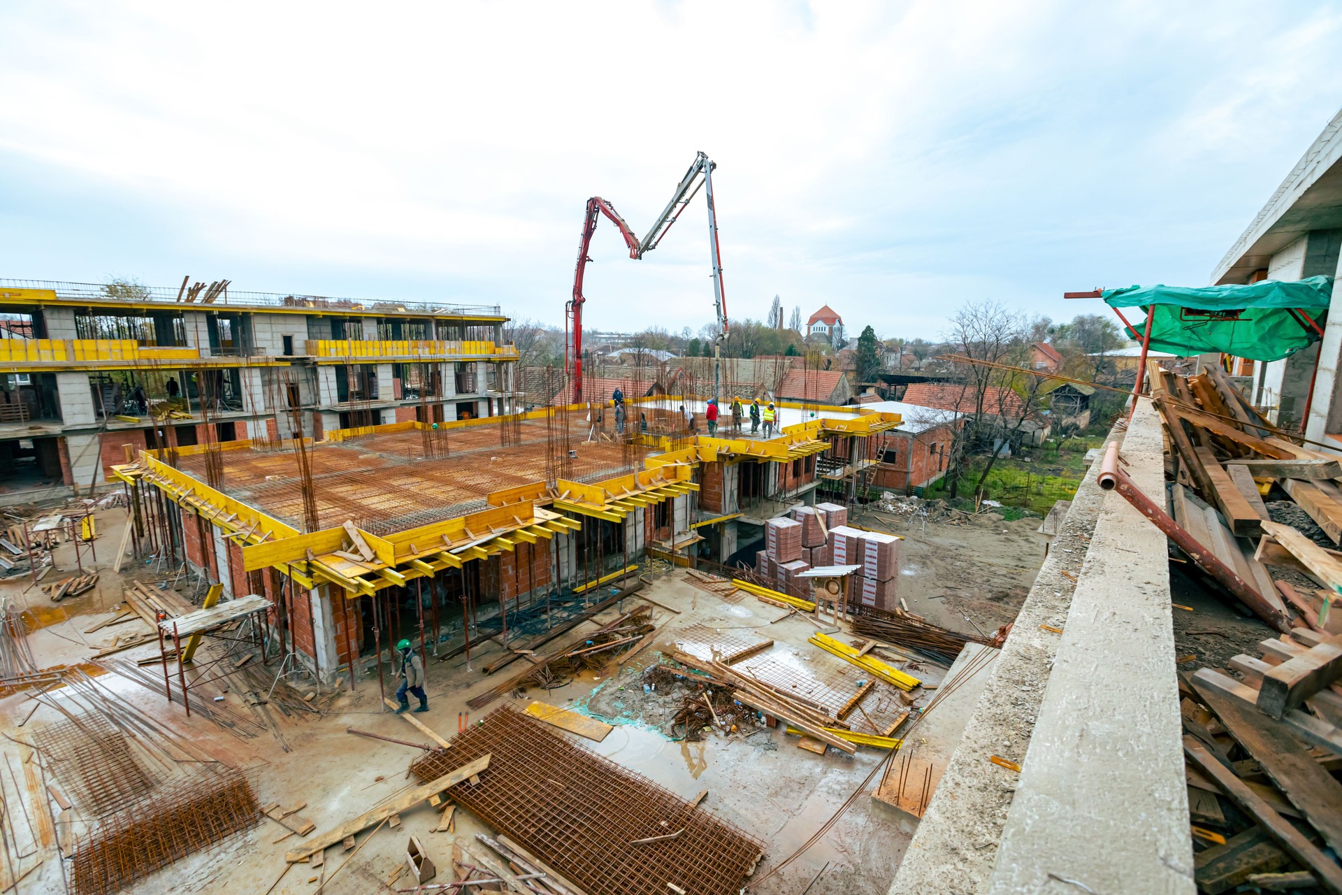 Truck with pump concrete is placed at building site for delivery